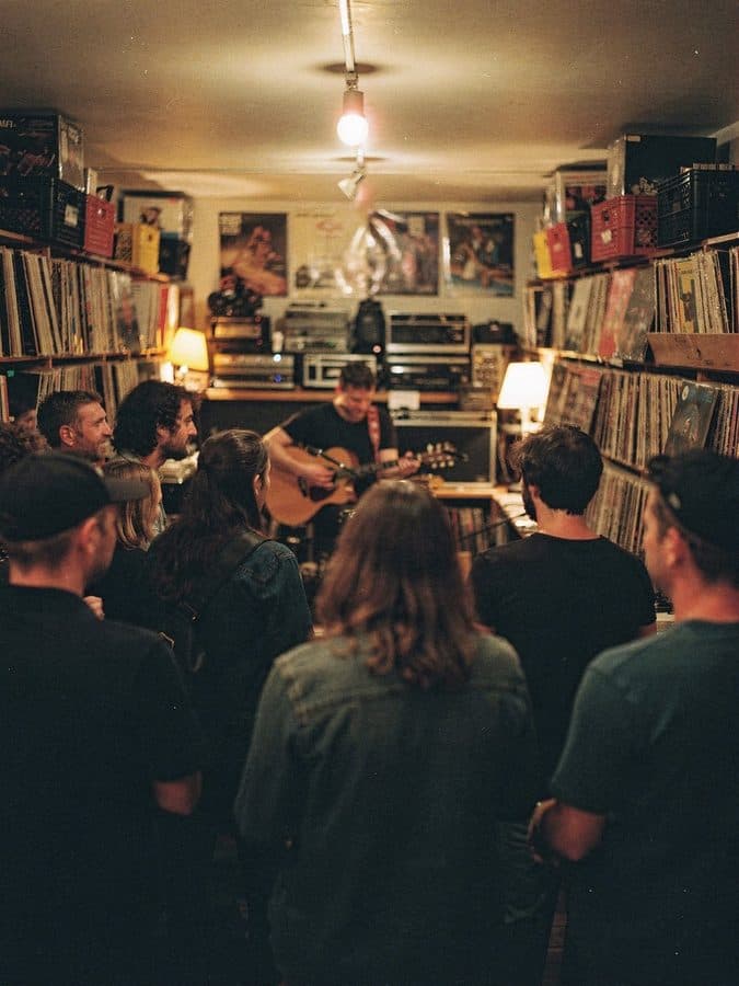 A small live gig in a record shop.